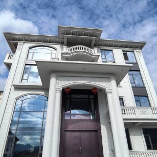 无锡白麻别墅外墙干挂石材效果示例